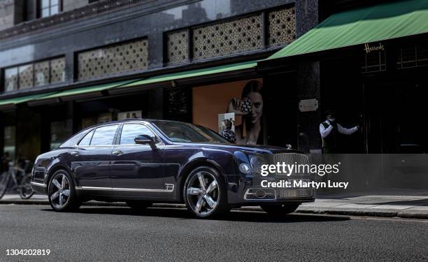 The Bentley Flying Spur outside Harrods, London. The Flying spur is Bentleys four-door variant of the Continental GT coupe.