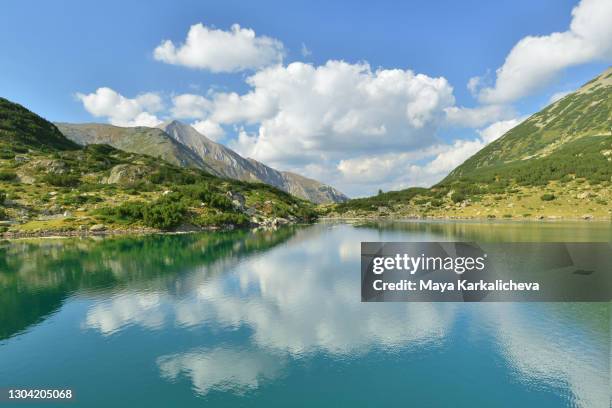 sunny day with beautiful clouds by a mountain lakeshore - pirin mountains stock pictures, royalty-free photos & images