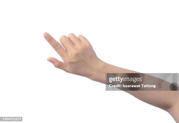 woman's hand touching or pointing to something isolated on white background. close up. high resolution. - hand pointing ストックフォトと画像