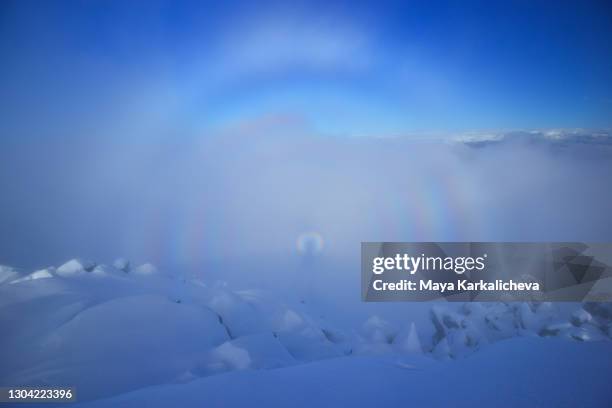 brocken spectre in the mountain - brockengespenst stock-fotos und bilder