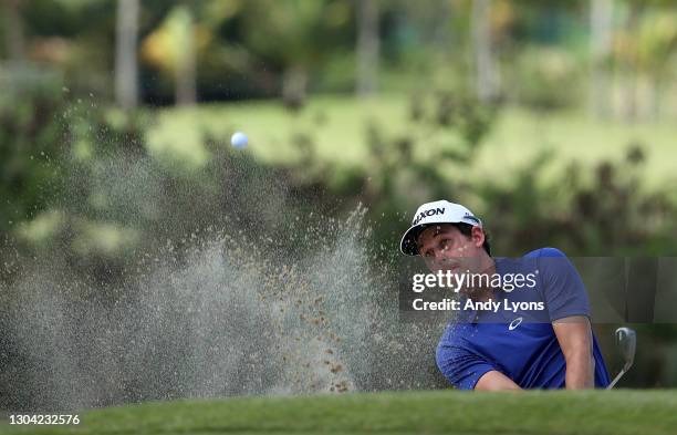 Andrew Putnam plays a shot from a bunker on the seventh hole during the second round of the Puerto Rico Open at Grand Reserve Country Club on...