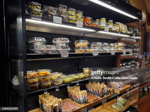 Side view of the refrigerated display case with a selection of olives, cheese and cakes at V. Sattui Winery in St Helena, California, February 6,...