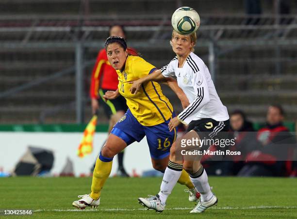 Saskia Bartusiak of Germany and Madelaine Edlund of Sweden battle for the ball during the Women's International friendly match between Germany and...