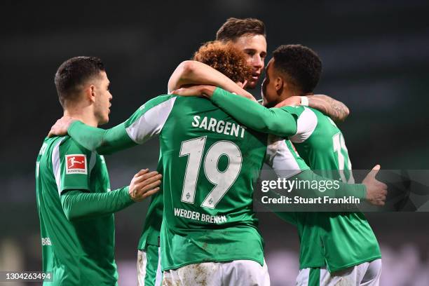 Goalscorer Josh Sargent of Werder Bremen is congratulated by team mates Milot Rashica , Marco Friedl and Felix Agu after scoring his team's second...