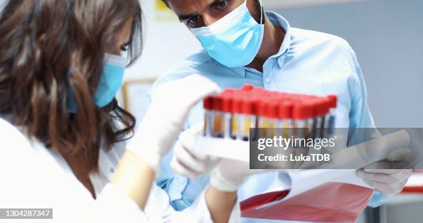 when a contagious infection takes over the world - medical research paper stock pictures, royalty-free photos & images
