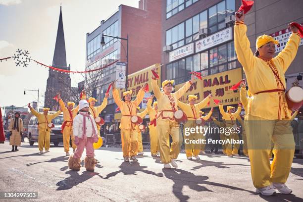 chinese dancers perform during chinese new year - flushing queens stock pictures, royalty-free photos & images