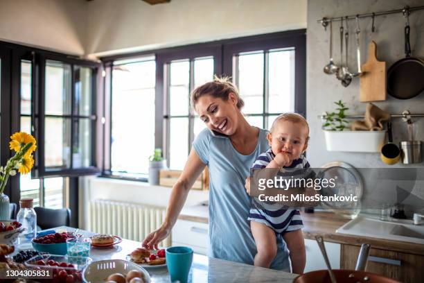 mom's morning - busy kitchen stock pictures, royalty-free photos & images