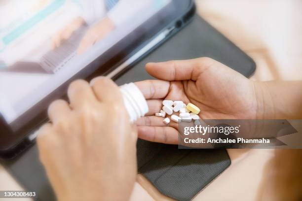 healthcare concept:  the patient use the laptop to consult the doctor by wireless application technology from home. - consultation lake stock pictures, royalty-free photos & images