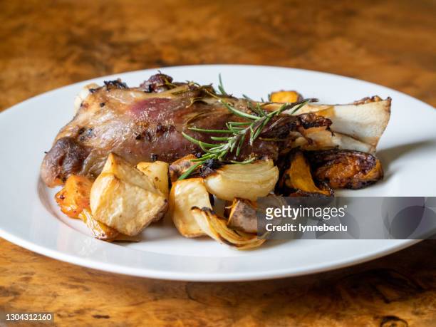 roast australian lamb shanks with vegetables - lamb shank stock pictures, royalty-free photos & images