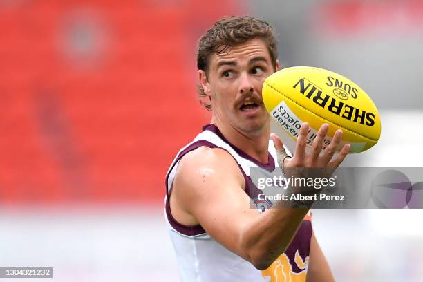 Joe Daniher of the Lions looks on during the AFL Practice Match between the Gold Coast Suns and the Brisbane Lions at Metricon Stadium on February...