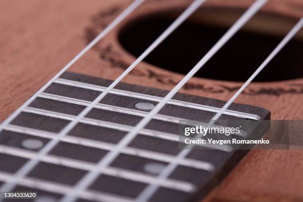 fretboard with strings as a background - musical instrument string stock pictures, royalty-free photos & images