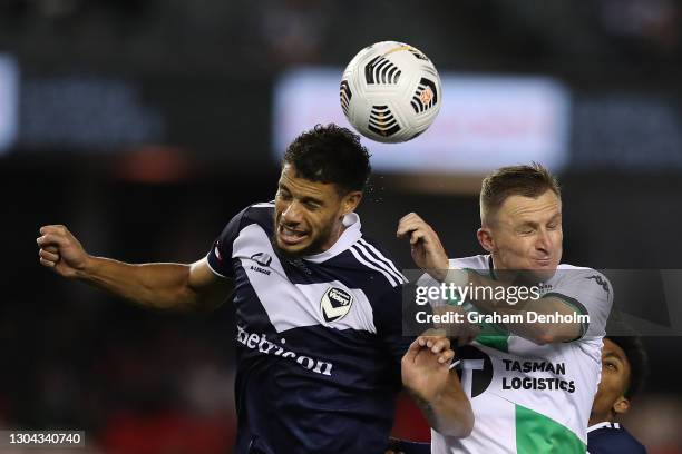 Besart Berisha of Western United and Rudy Gestede of the Victory compete in the air during the A-League match between the Melbourne Victory and...