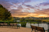 Park benches along Willamette River at Riverfront City Park in Salem OR sunset