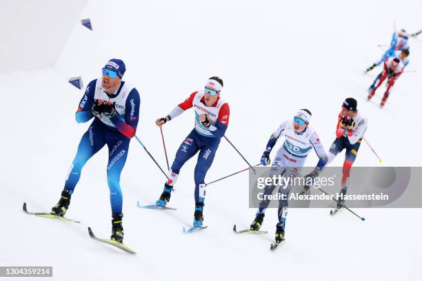 Andrew Musgrave of Great Britain and William Poromaa of Sweden compete during the Men's Cross Country Skiathlon 15 km/15 km C/F at the FIS Nordic...