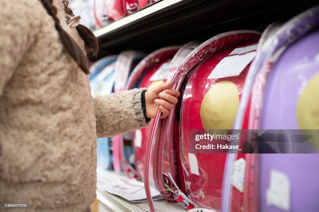 Child choosing a school bag
