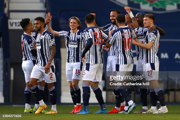Kyle Bartley of West Bromwich Albion celebrates with teammates after scoring his team's first goal during the Premier League match between West...