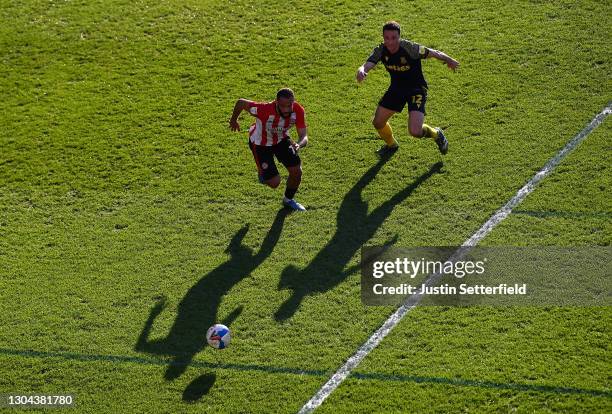 Bryan Mbeumo of Brentford is put under pressure by James Chester of Stoke City during the Sky Bet Championship match between Brentford and Stoke City...