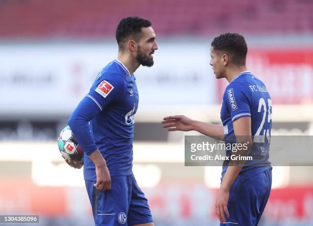 Nabil Bentaleb and Amine Harit of FC Schalke 04 clash over who should take a penalty for FC Schalke 04, before Nabil Bentaleb of FC Schalke 04 goes...