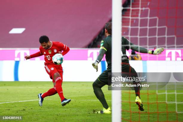 Serge Gnabry of FC Bayern Muenchen scores his team's fifth goal past Timo Horn of 1. FC Koeln during the Bundesliga match between FC Bayern Muenchen...