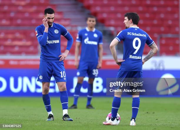 Nabil Bentaleb and Benito Raman of FC Schalke 04 look dejected after conceding a fourth goal during the Bundesliga match between VfB Stuttgart and FC...