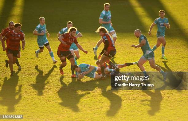 Ashley Beck of Worcester Warriors is tackled by George Barton of Gloucester Rugby during the Gallagher Premiership Rugby match between Gloucester and...