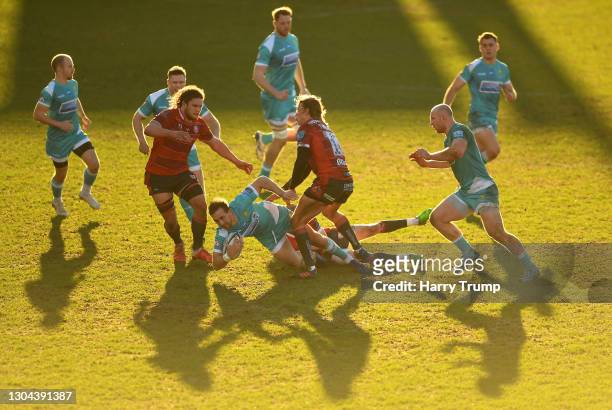 Ashley Beck of Worcester Warriors is tackled by George Barton of Gloucester Rugby during the Gallagher Premiership Rugby match between Gloucester and...