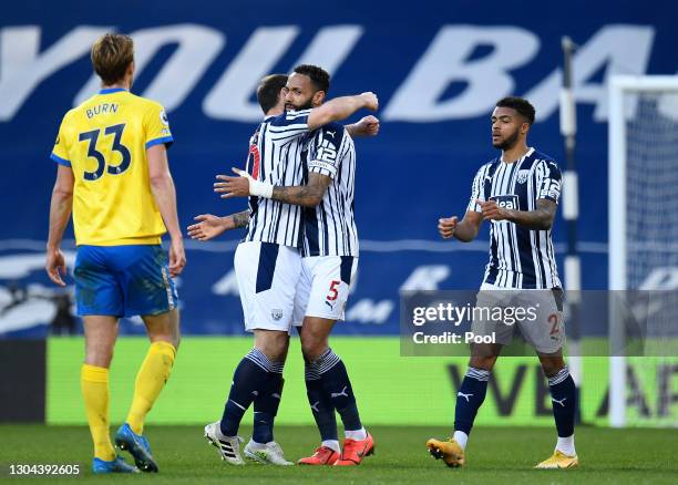 Branislav Ivanovic and Kyle Bartley of West Bromwich Albion celebrate following their team's victory in the Premier League match between West...