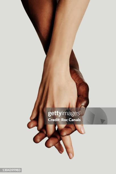 hands clasped - holding hands ストックフォトと画像
