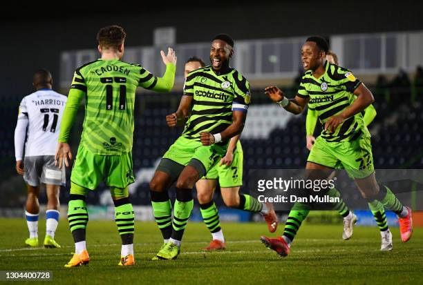 Jamille Matt of Forest Green Rovers celebrates with Nicky Cadden and Udoka Godwin-Malife after scoring his sides second goal during the Sky Bet...