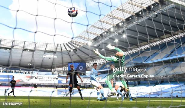 Ruben Dias of Manchester City scores his team's first goal past Darren Randolph of West Ham United during the Premier League match between Manchester...