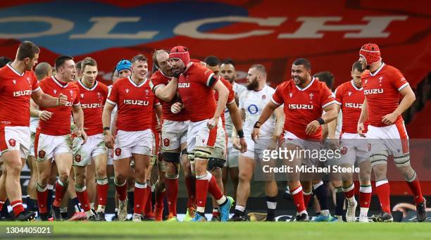 Alun Wyn Jones of Wales congratulates Cory Hill of Wales after scoring their side's fourth try during the Guinness Six Nations match between Wales...
