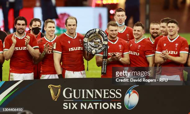 Alun Wyn Jones and Dan Biggar of Wales lift the Triple Crown trophy following their side's victory in the Guinness Six Nations match between Wales...