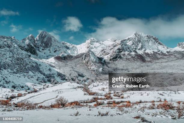 snowcapped mountain range in day light - picos de europe stock pictures, royalty-free photos & images