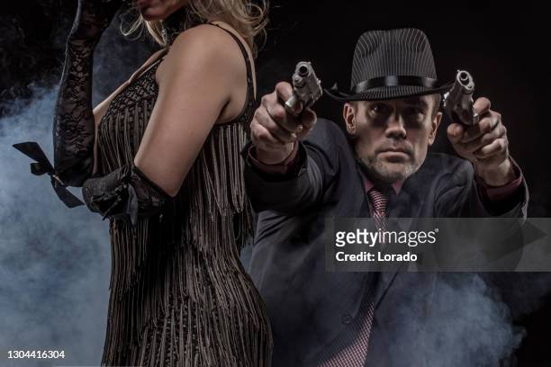 portrait of a vintage gangster couple - female gangster stock pictures, royalty-free photos & images