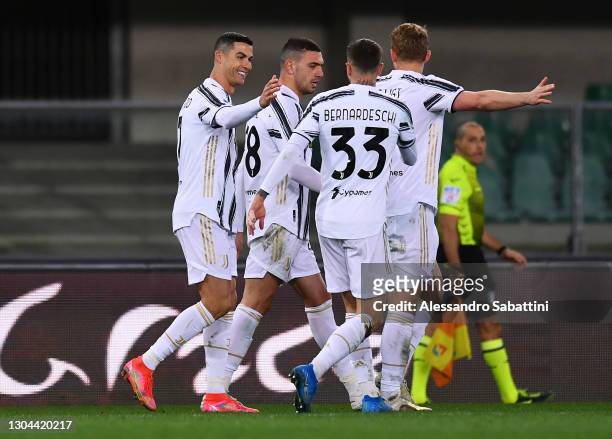Cristiano Ronaldo of Juventus celebrates with team mates Federico Bernardeschi, Matthijs De Ligt and Merih Demiral after scoring their side's first...
