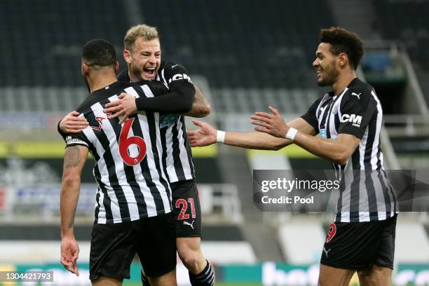 Jamaal Lascelles of Newcastle United celebrates with team mates Ryan Fraser and Joelinton after scoring their side's first goal during the Premier...