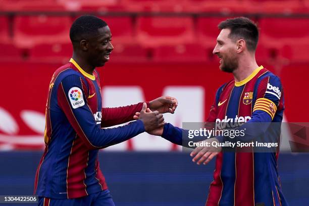 Ousmane Dembele of FC Barcelona celebrates after scoring his team's first goal with his teammate Lionel Messi during the La Liga Santander match...