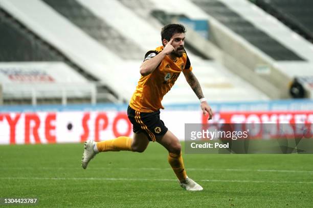 Ruben Neves of Wolverhampton Wanderers celebrates after scoring their side's first goal during the Premier League match between Newcastle United and...