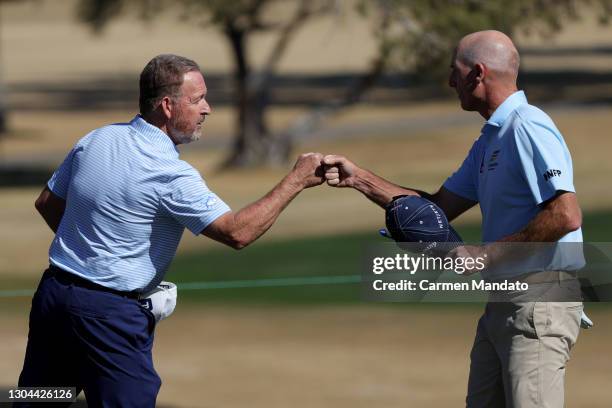 Jim Furyk and Jeff Maggert fist bump on the 18th green during round two of the Cologuard Classic at the Catalina Course of the Omni Tucson National...