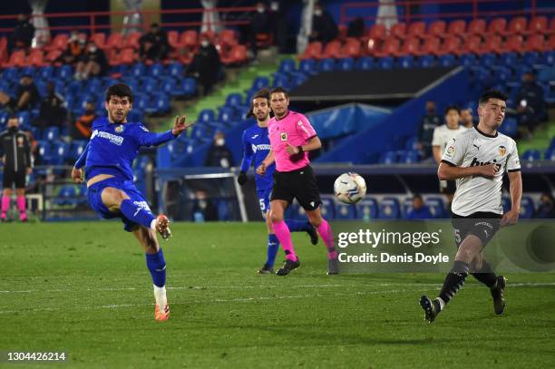 Carles Alena of Getafe CF scores their side's third goal during the La Liga Santander match between Getafe CF and Valencia CF at Coliseum Alfonso...