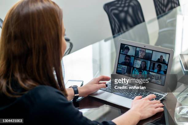 woman watching a video conference with nine people. image for paste to your screen. - medium group of people stock pictures, royalty-free photos & images