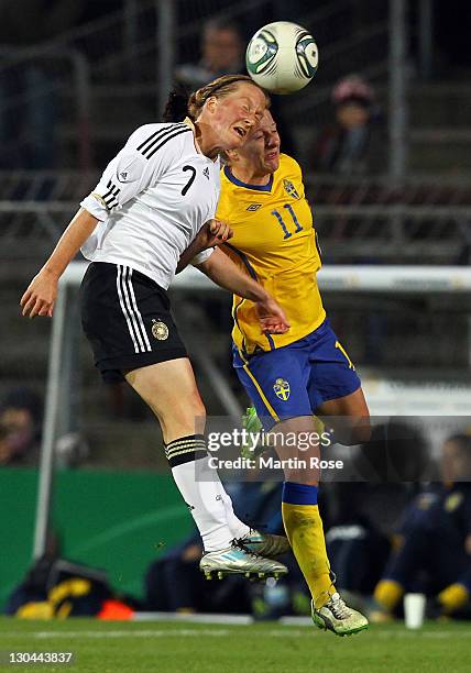 Melanie Behringer of Germany and Antonia Goeransson of Sweden head for the ball during the Women's International friendly match between Germany and...