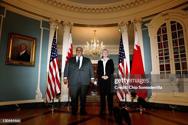 Bahraini Foreign Minister Shaikh Khalid bin Ahmed al-Khalifa and U.S. Secretary of State Hillary Clinton make brief remarks in the Treaty Room before...