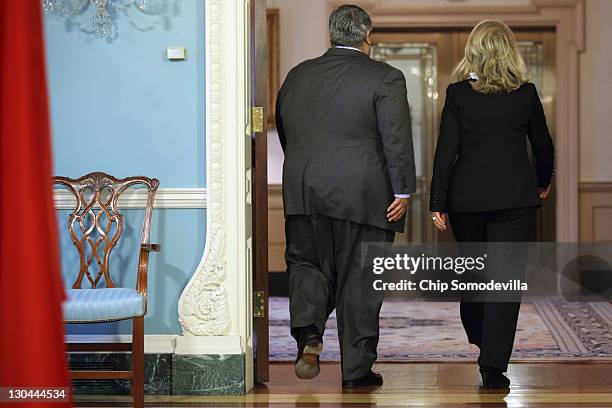 Bahraini Foreign Minister Shaikh Khalid bin Ahmed al-Khalifa and U.S. Secretary of State Hillary Clinton leave after a media availability in the...