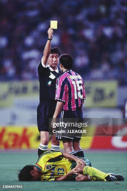 Yoshito Okubo of Cerezo Osaka is shown a yellow card by referee Hideaki Harada during the J.League J1 second stage match between Cerezo Osaka and JEF...