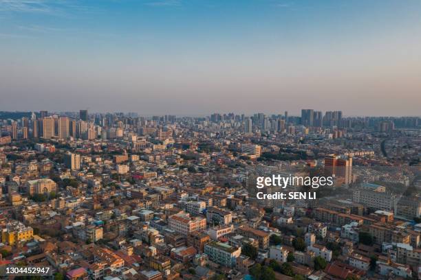 aerial view of old city and modern city skyline in quanzhou at dusk - quanzhou stock pictures, royalty-free photos & images