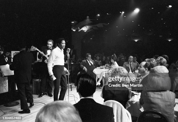 Sam Cooke , singer, songwriter and civil-rights activist, on stage with band at New York's Copacabana nightclub, June 1964.