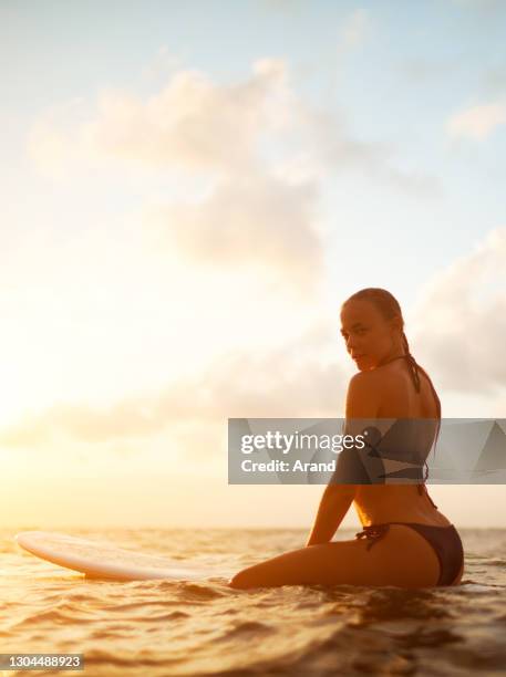 young surfer woman - hot model indonesia stock pictures, royalty-free photos & images