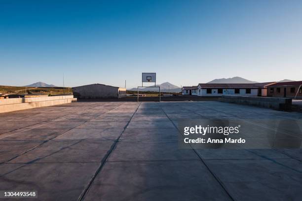 basket ball court of a small village close to salar de uyuni - campo di allenamento foto e immagini stock