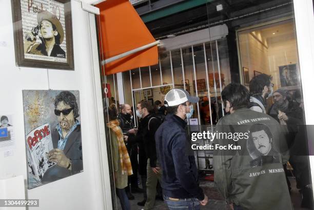 Street artist /spray painter Jean Yarps from back with his Jacques Mesrine painted jacket attends Tribute to Serge Gainsbourg At Marché Dauphine -...